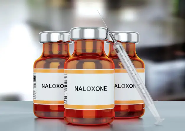 Naloxone medication vials with syringe used to reverse opioid overdose by restoring breathing